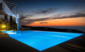 infinity pool in the backyard at night