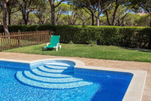 How to Keep Grass Out of Your Pool When You Are Mowing